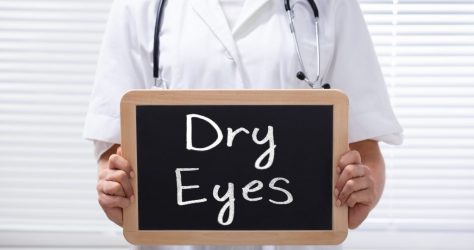 Female Doctor Holding Slate With Dry Eyes Text